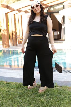 RENKTE GENİŞ KESİM SİYAH ETEK PANTOLON