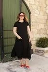 RENKTE CEBİ VE ETEK UCU PÜSKÜLLÜ SİYAH ELBİSE