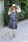 RENKTE GENİŞ KESİM  İP ASKILI DESENLİ ELBİSE