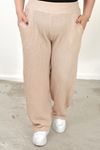 RENKTE BÜYÜK BEDEN CEPLİ BELİ LASTİKLİ BEJ BOL PAÇA PANTALON